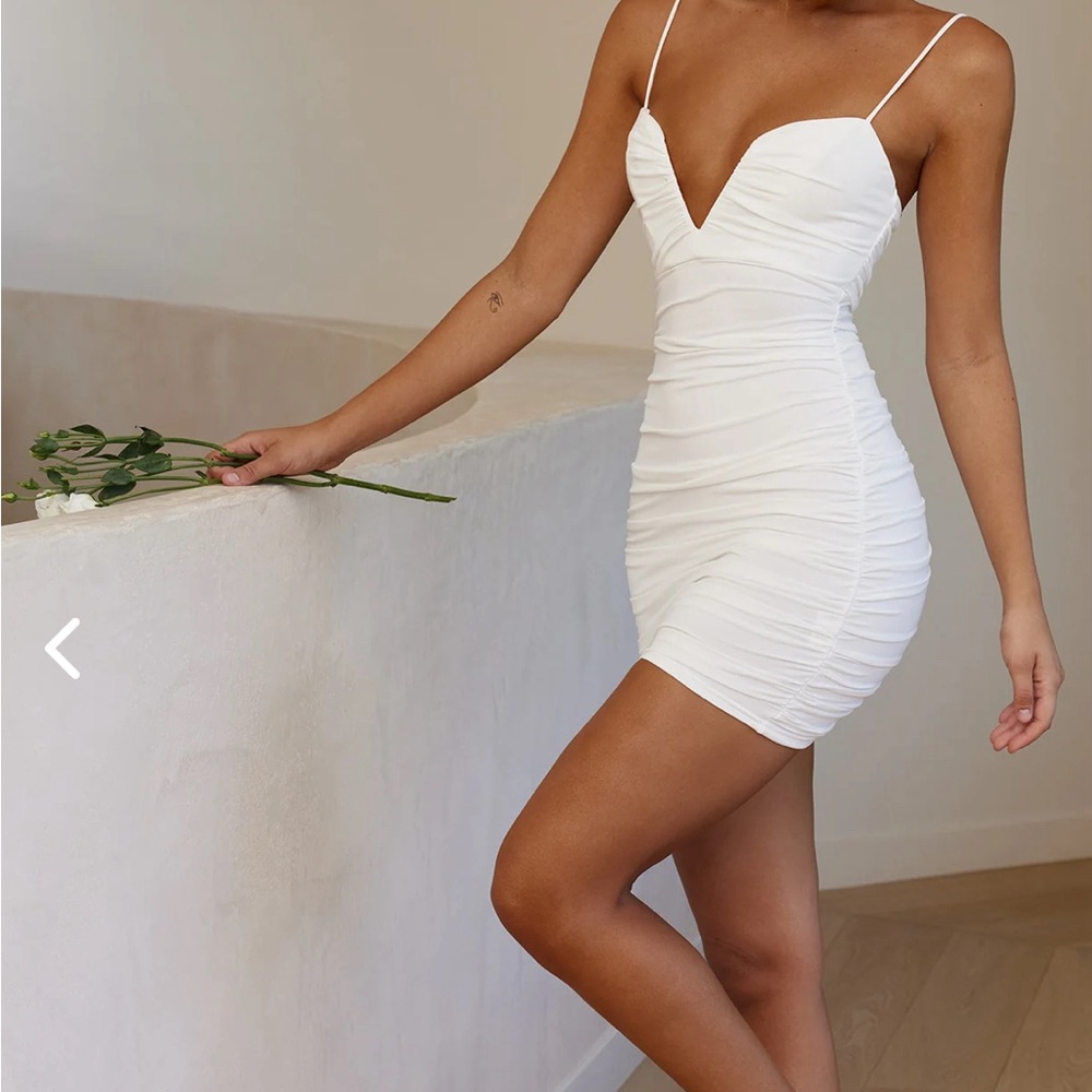 Selfie Leslie NWOT white mini dress. M Runs small. So more like an S. Super sexy